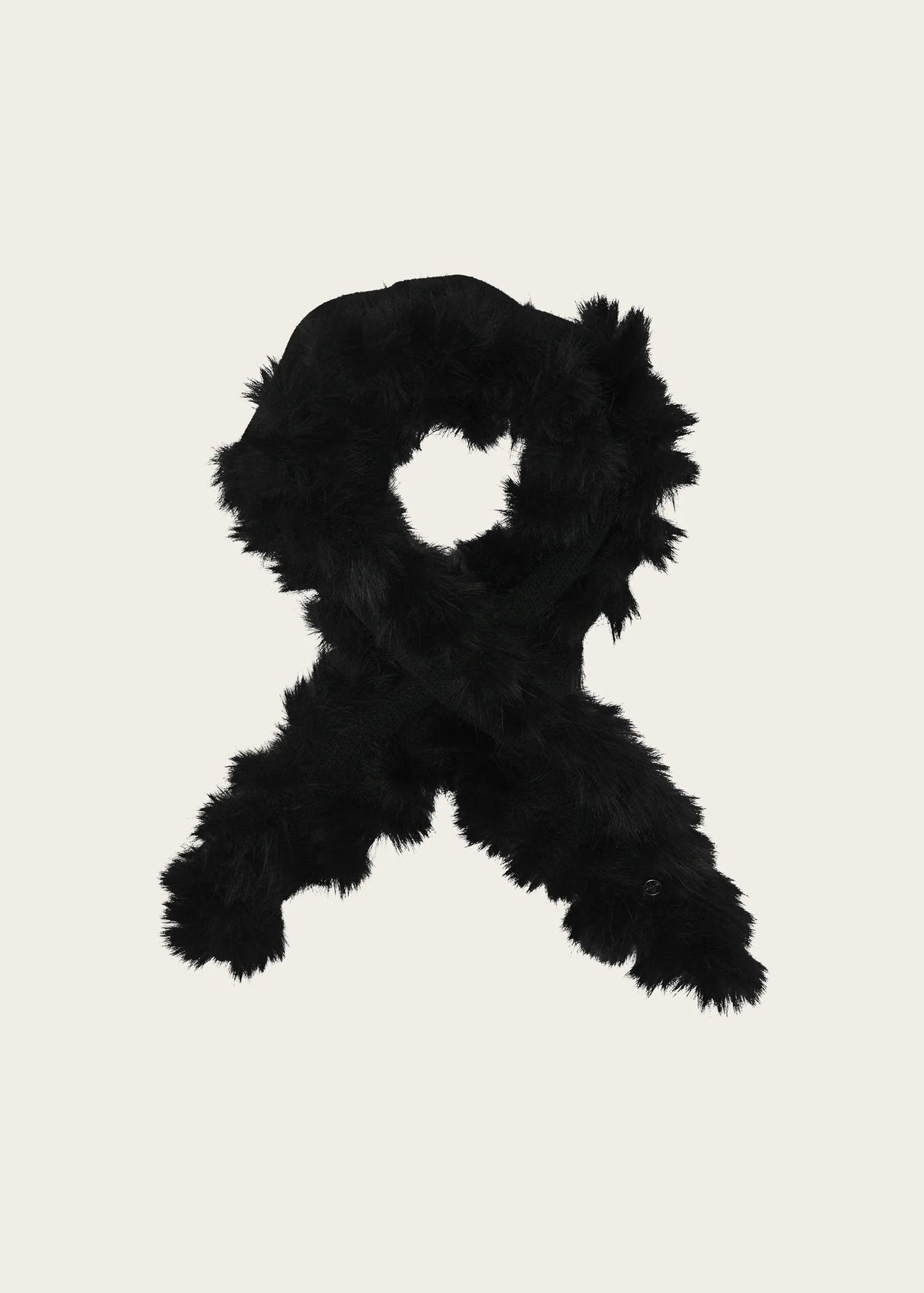 A black faux fur scarf arranged in a loop shape on a solid light beige background.