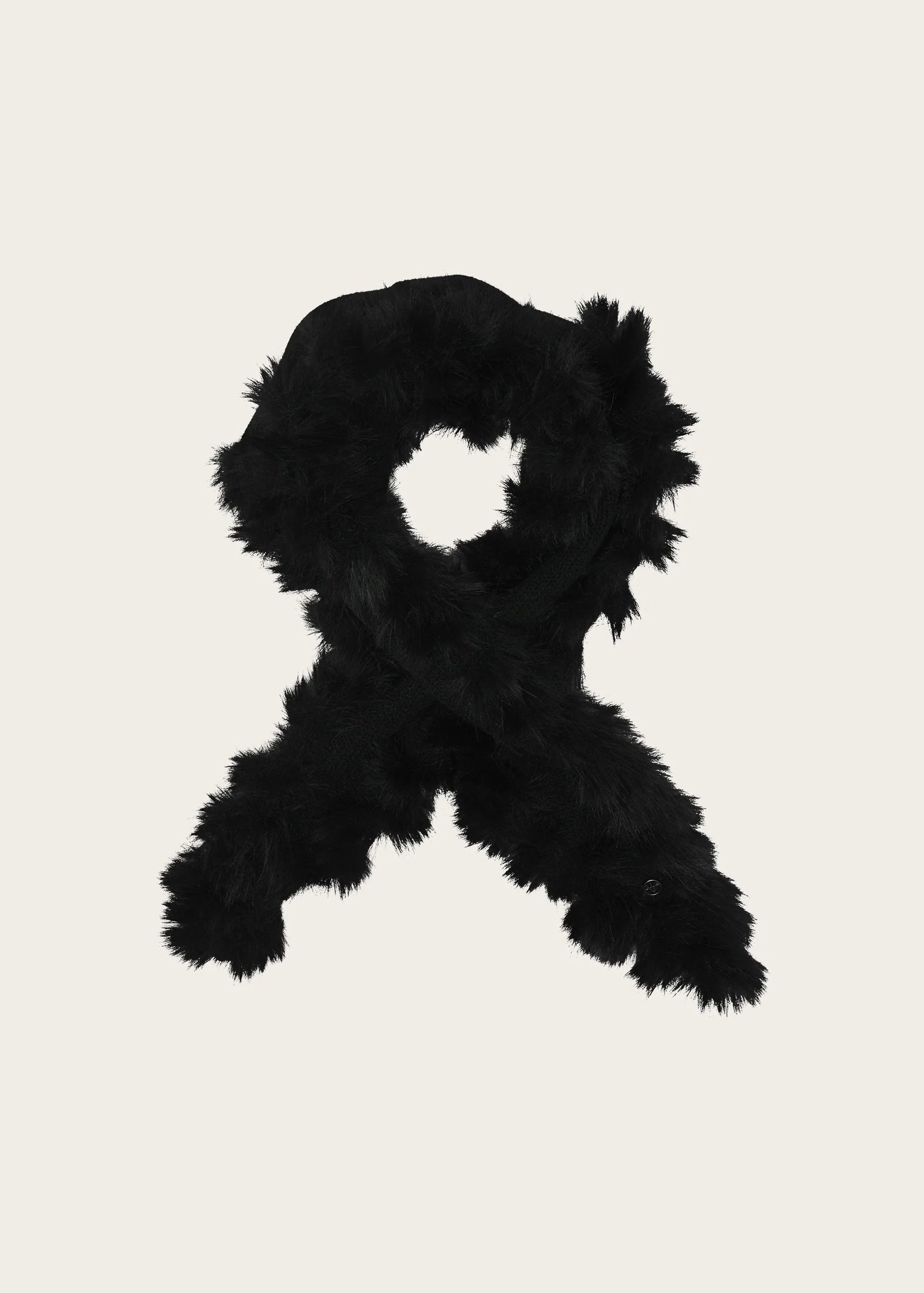 A black faux fur scarf arranged in a loop shape on a solid light beige background.
