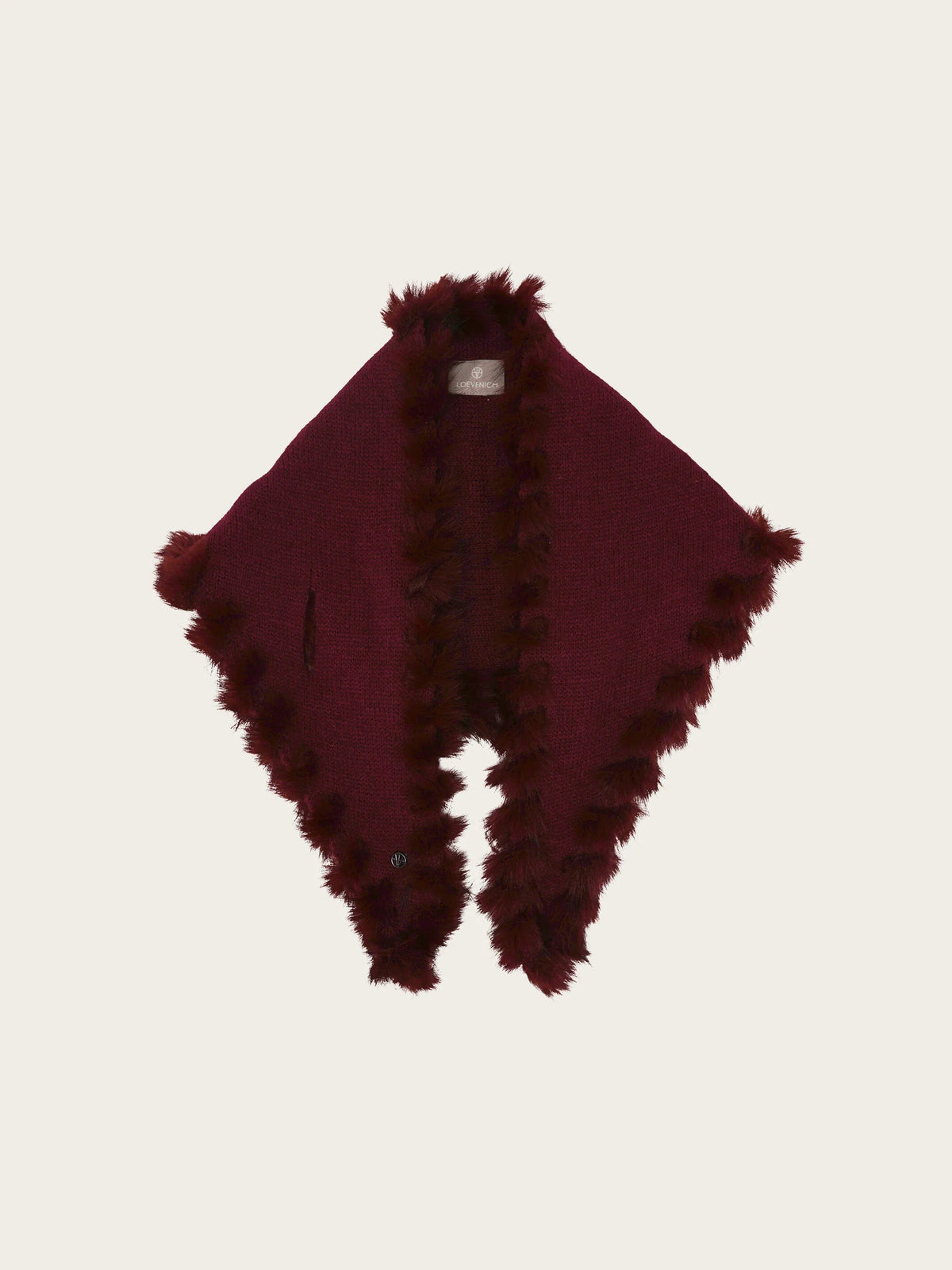 A deep burgundy shawl with plush, fluffy trim along the edges, displayed flat against a light off-white background.