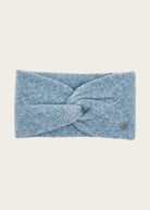 A light blue heathered knit headband with a central twisted knot and a small metallic logo emblem on the right side, shown against a solid off-white background.