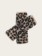 A pair of fuzzy knit fingerless gloves with a black leopard print on a beige background, displayed against a solid light gray backdrop.